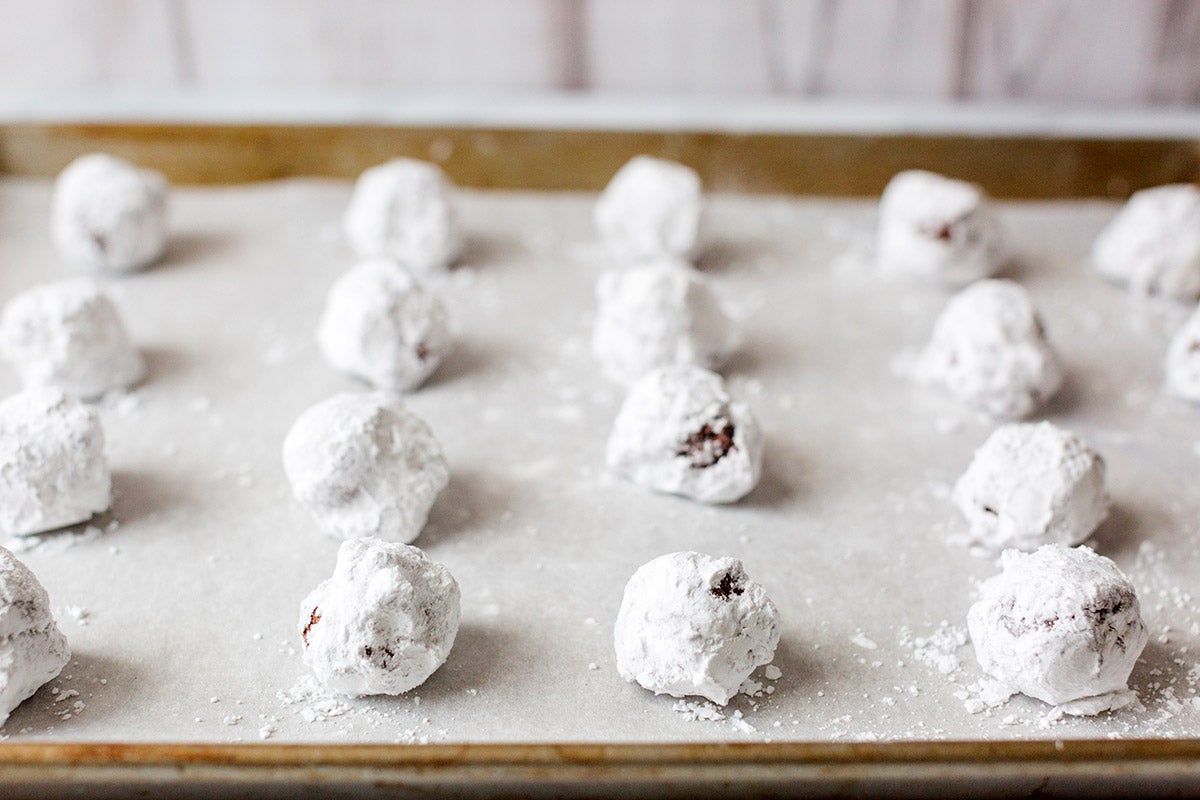 A batch of Chooclate Crinkles on a baking sheet, ready to be baked
