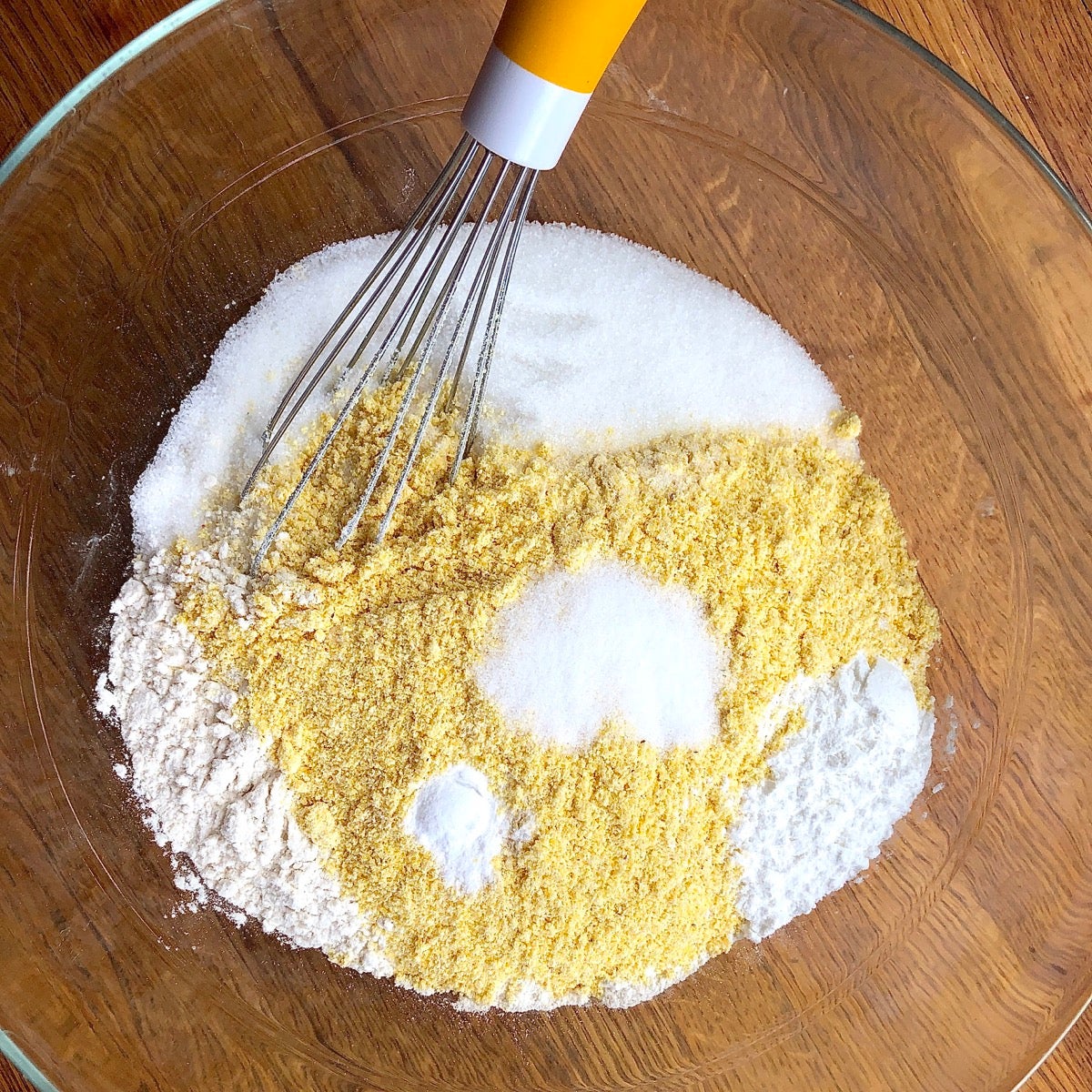 Dry ingredients for cornbread in a bowl ready to be whisked