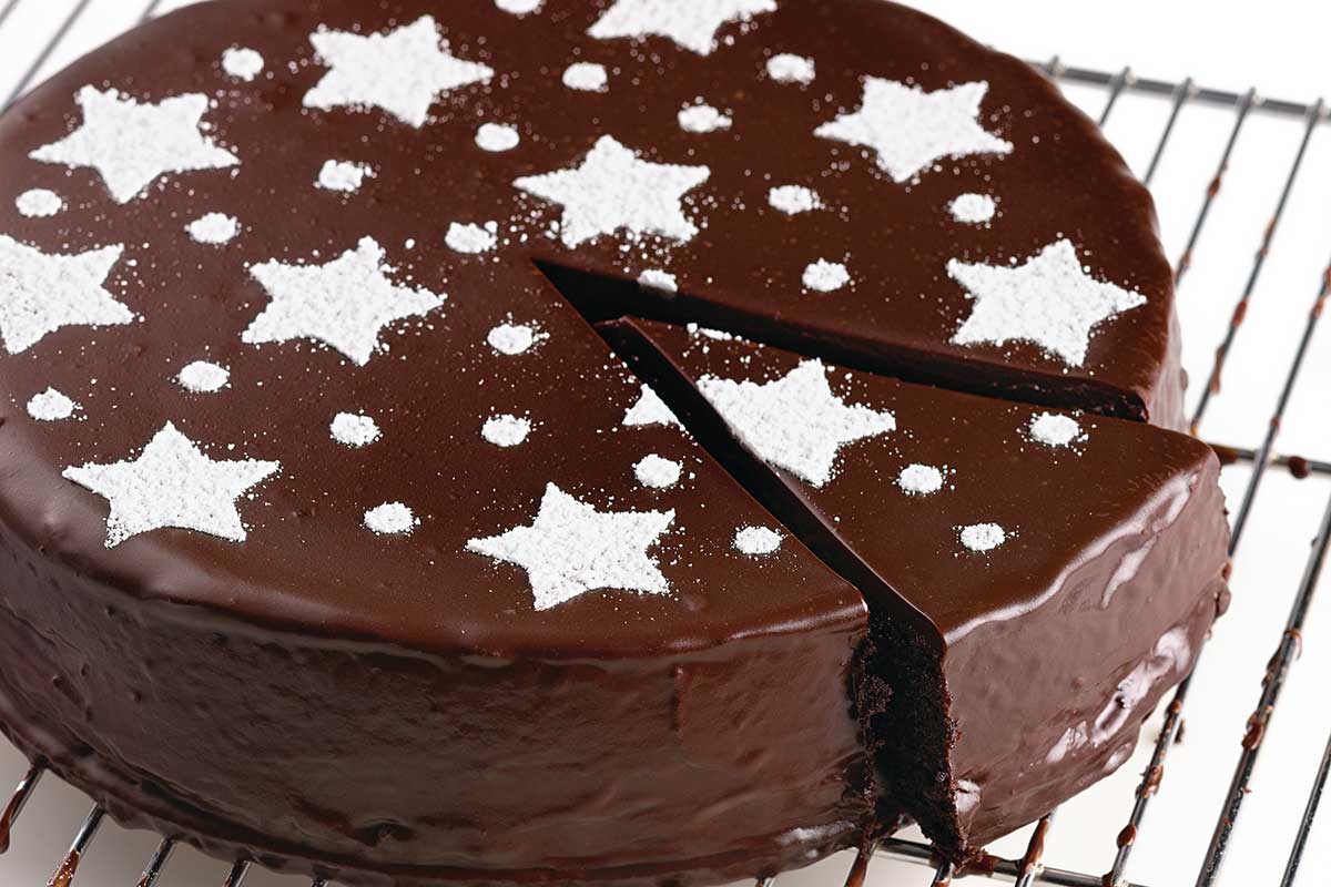 A flourless chocolate cake stenciled with stars on top