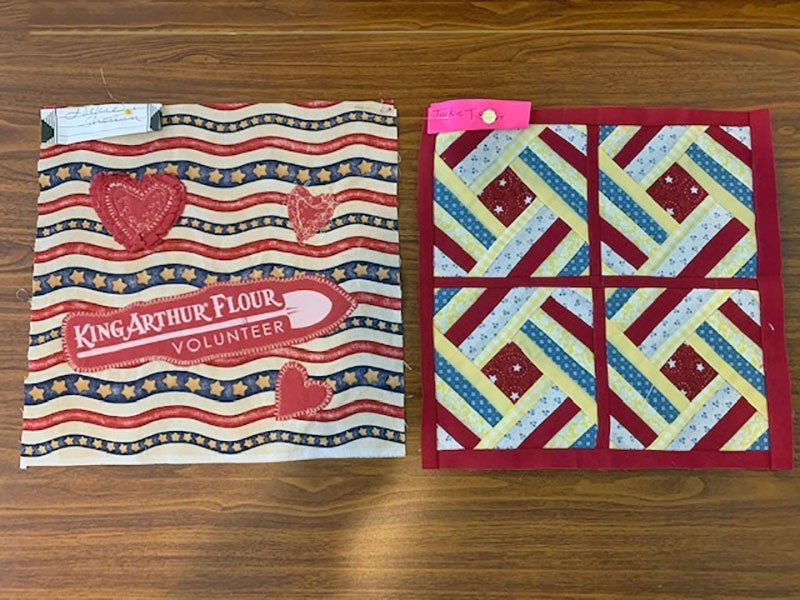 Two quilt squares, including Jackie Sherwin's inspired by volunteering 