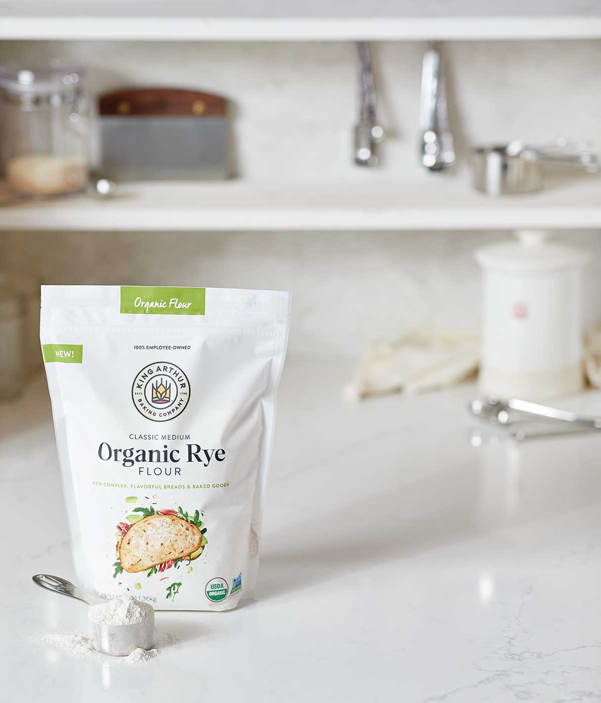 A bag of King Arthur Organic Medium Rye Flour on a kitchen table