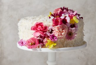 Coconut cake decorated with pink flowers