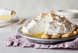Mile-High Meringue Pie with slice cut out