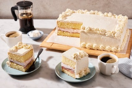 Sliced raspberry honey sheet cake layer cake