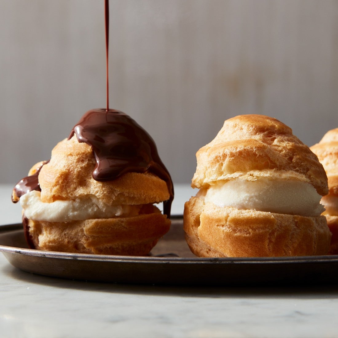Filled and iced cream puffs