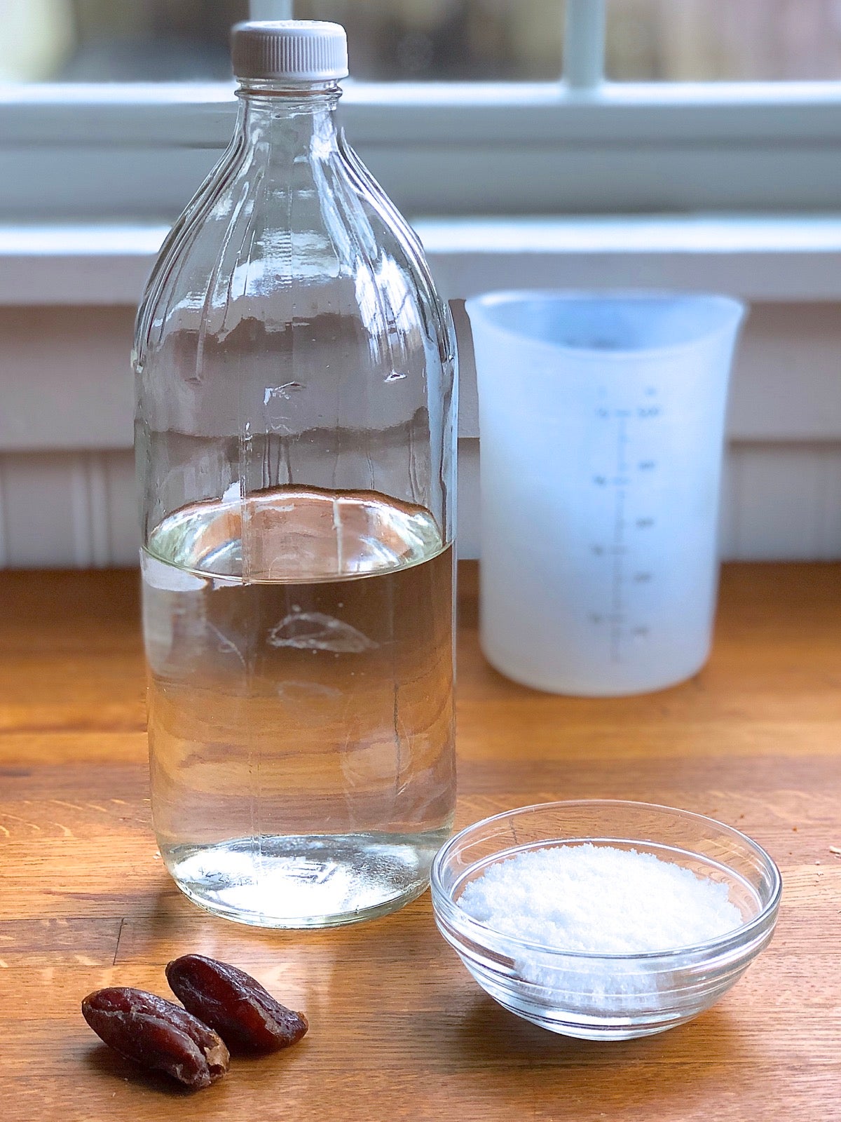Dried dates, sugar, and water ready to pour into a 32-ounce bottle.