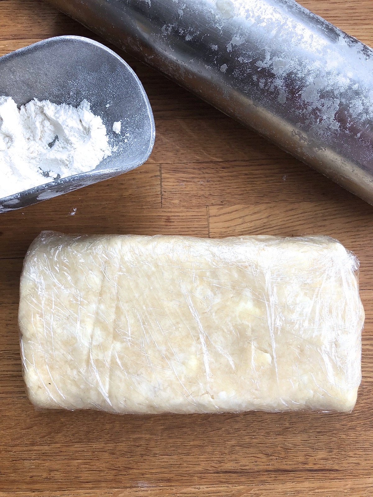 Super-flaky pie crust dough wrapped in plastic for the refrigerator