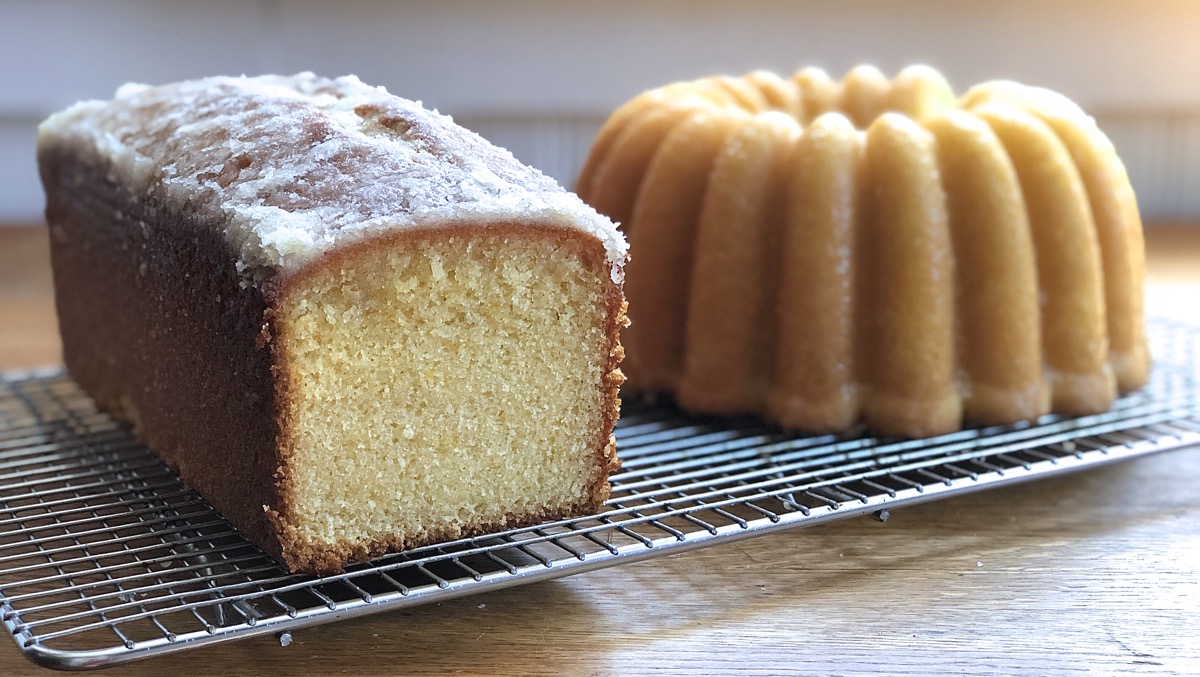 Orange pound cakes, one baked in a 9" x 4" loaf pan, one in a bundt pan