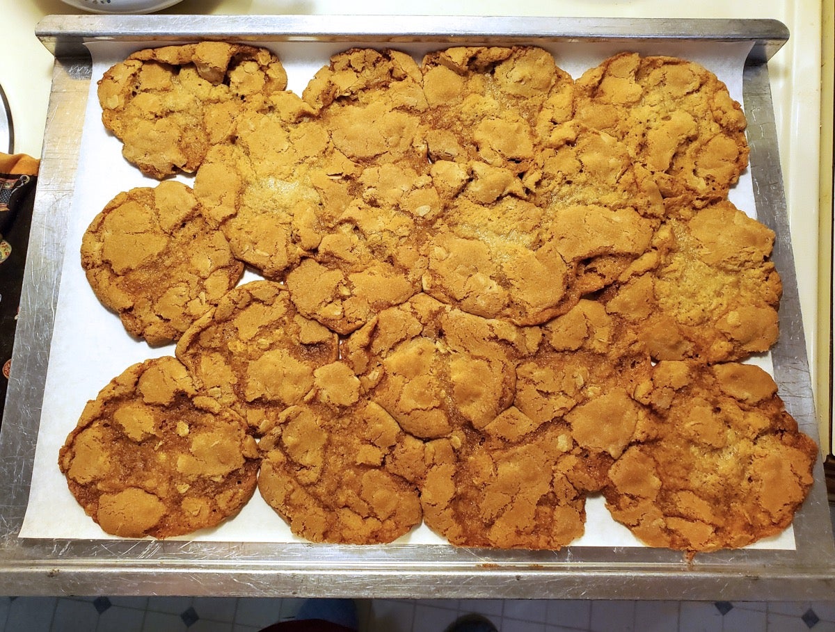 Oatmeal cookies baked into a giant puddle on a baking sheet.