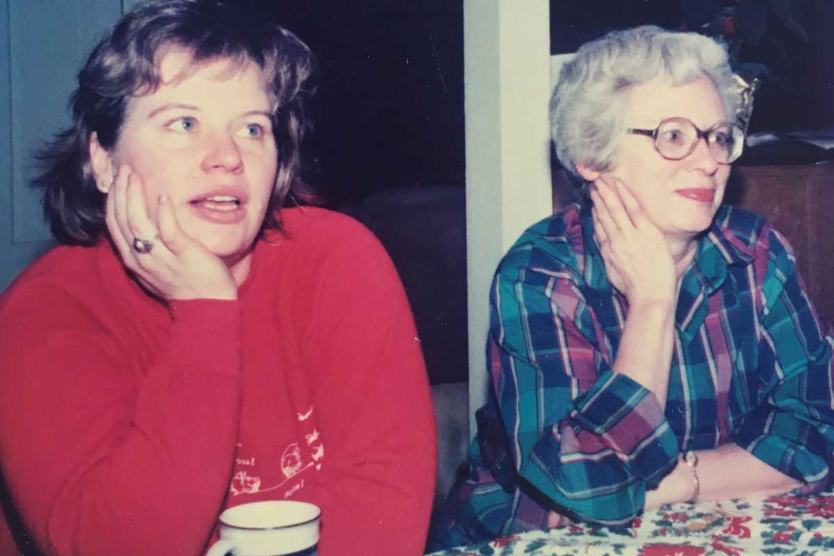 Two women sitting side by side, mother and daughter