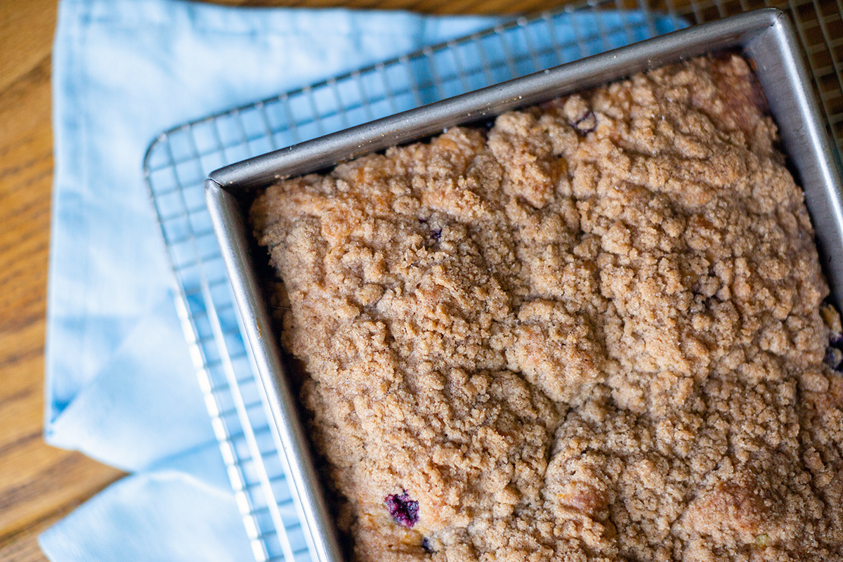 A pan of Blueberry Buckle Coffeecake on a cooling rack