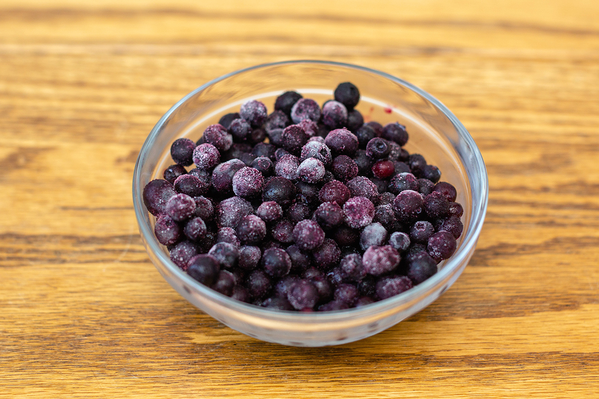 A bowl of frozen blueberries, ready for baking