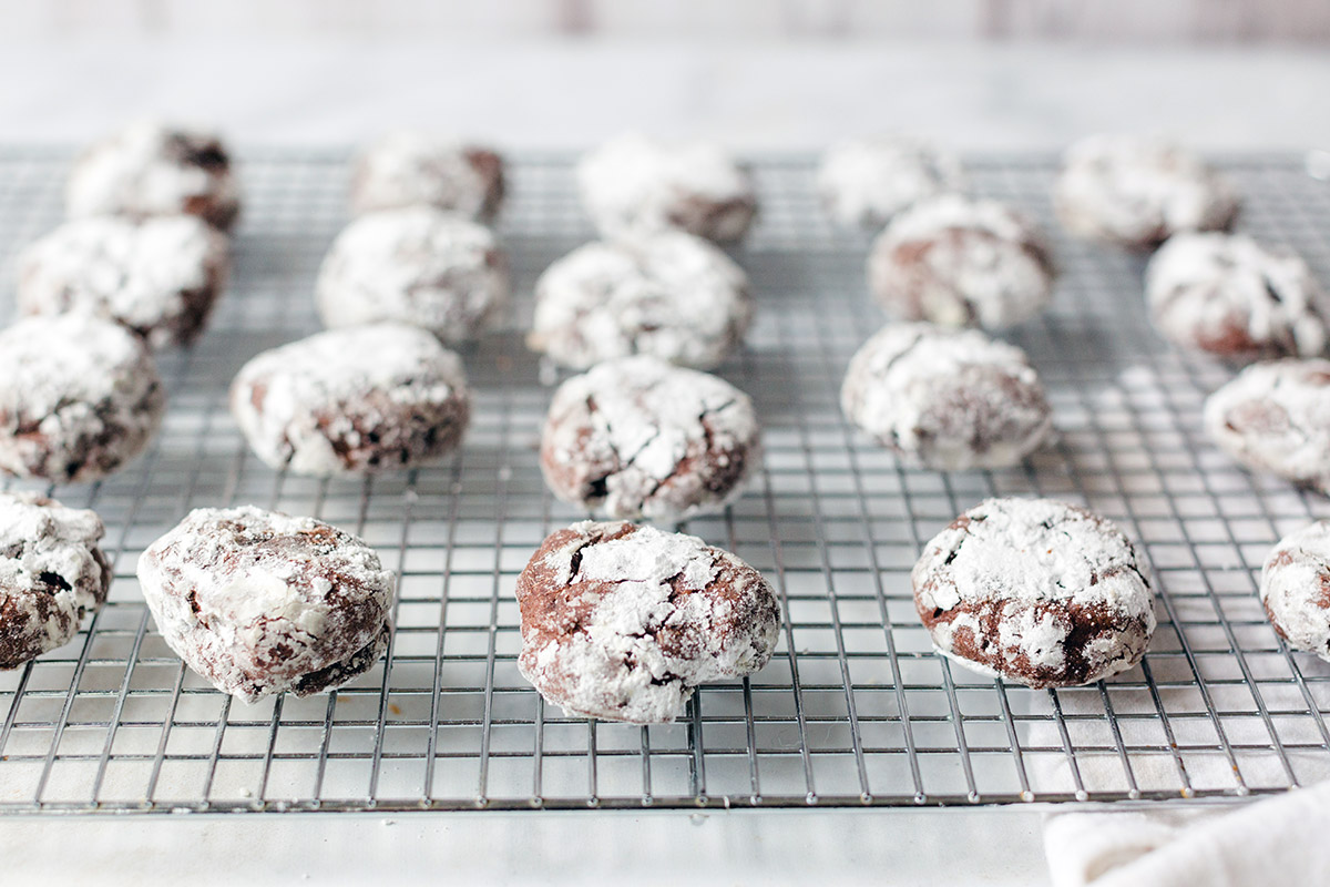 A batch of Chocolate Crinkles on a cooling rack