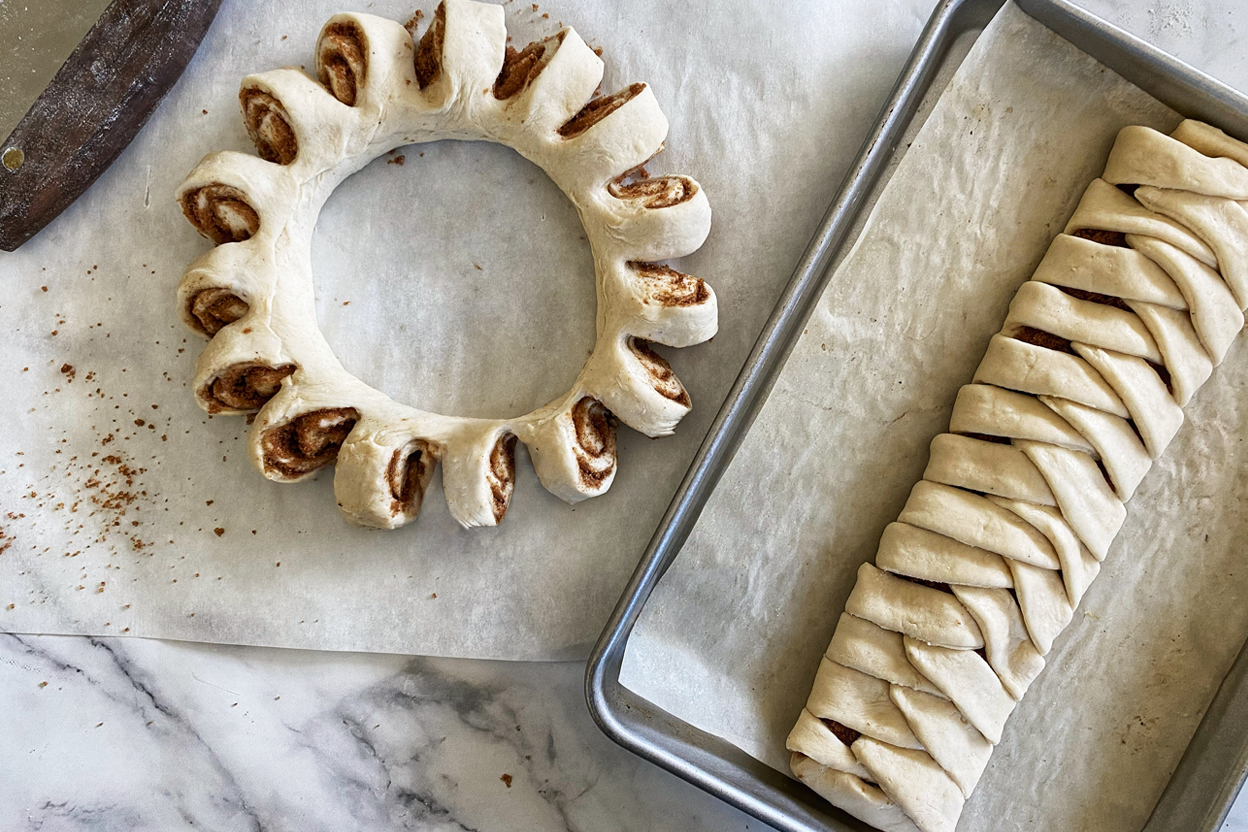 A Swedish tea ring and mock braid made from a log of cinnamon roll dough