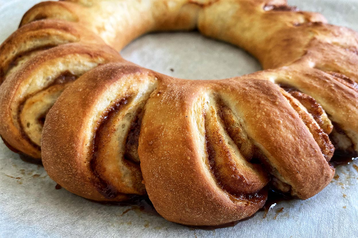 A baked Swedish tea ring filled with cinnamon sugar