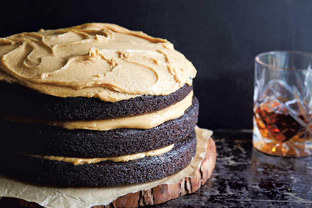 A three layer chocolate cake topped and filled with peanut butter frosting