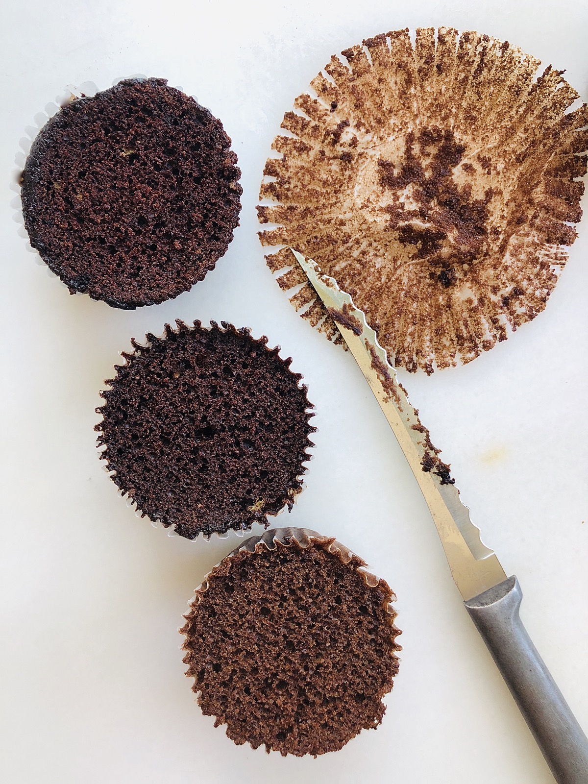 Cupcakes calling for Dutch-process cocoa baked instead with natural cocoa, and baked with natural cocoa with an adjustment to the leavening.