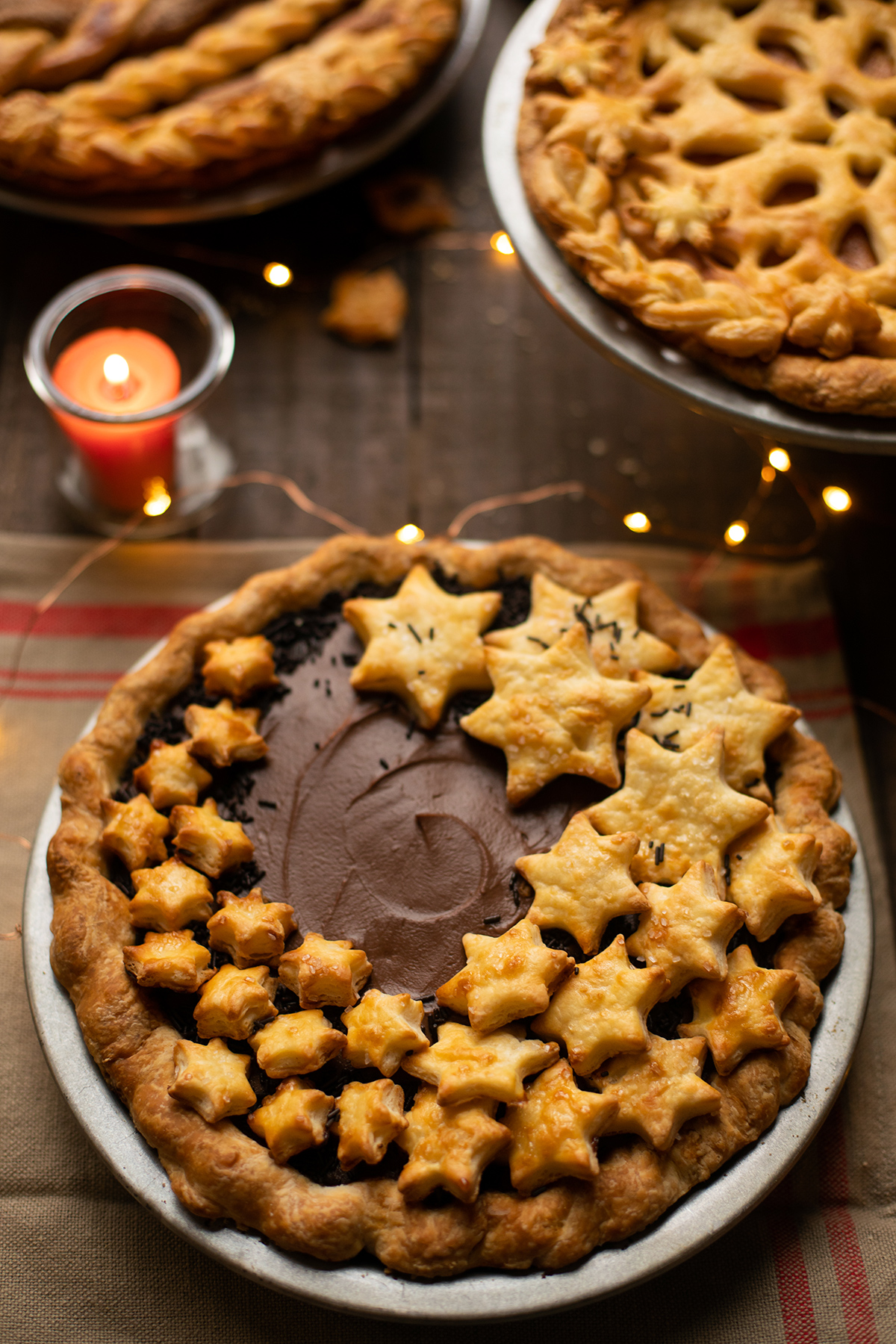 Chocolate cream pie with star-shaped pie crust cutouts on top