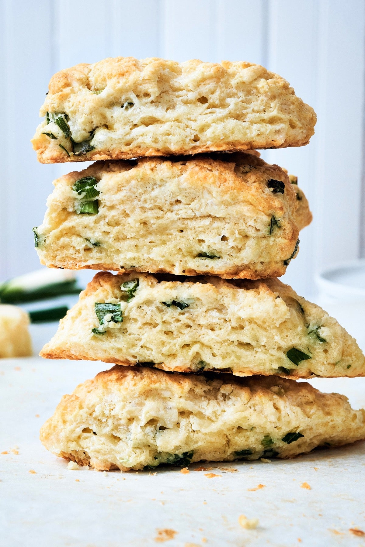 Stack of four Cheddar and Scallion Scones.