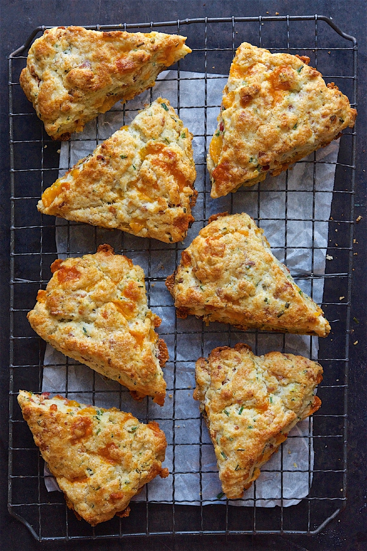Bacon-cheddar-chive scones on a cooling rack.