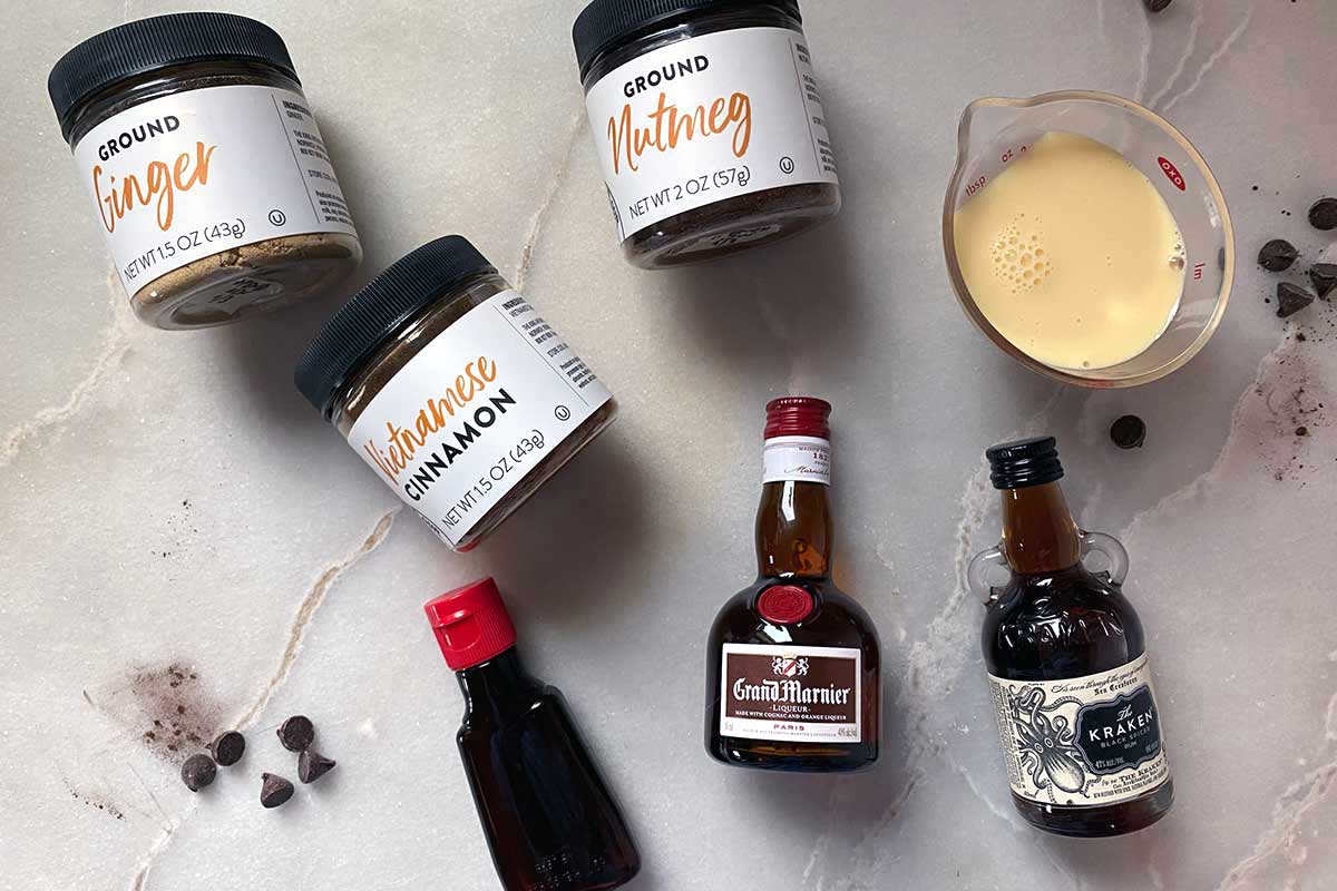 Small bottles of liquor as well as spices to flavor a flourless chocolate cake