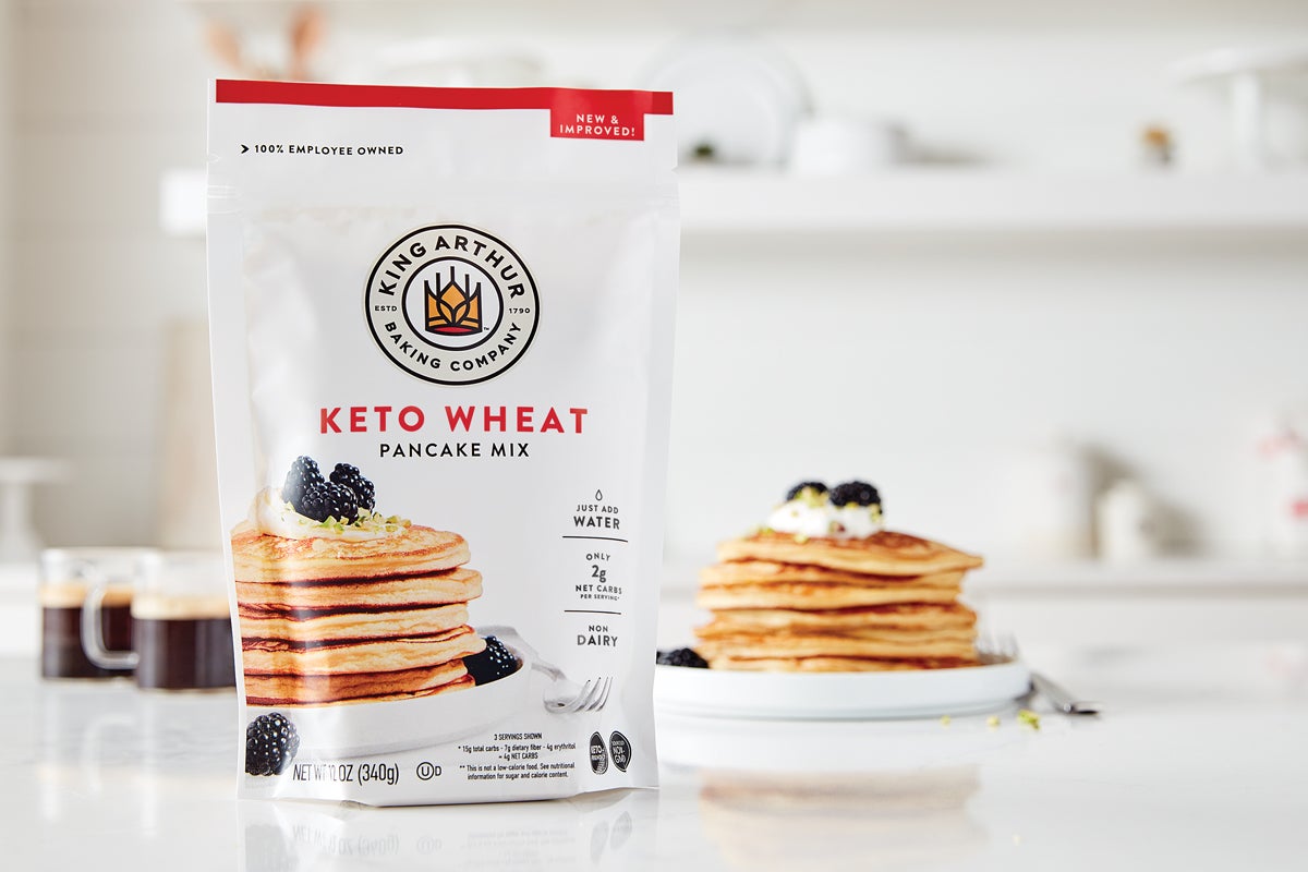 Keto wheat pancake mix bag in front of keto pancakes