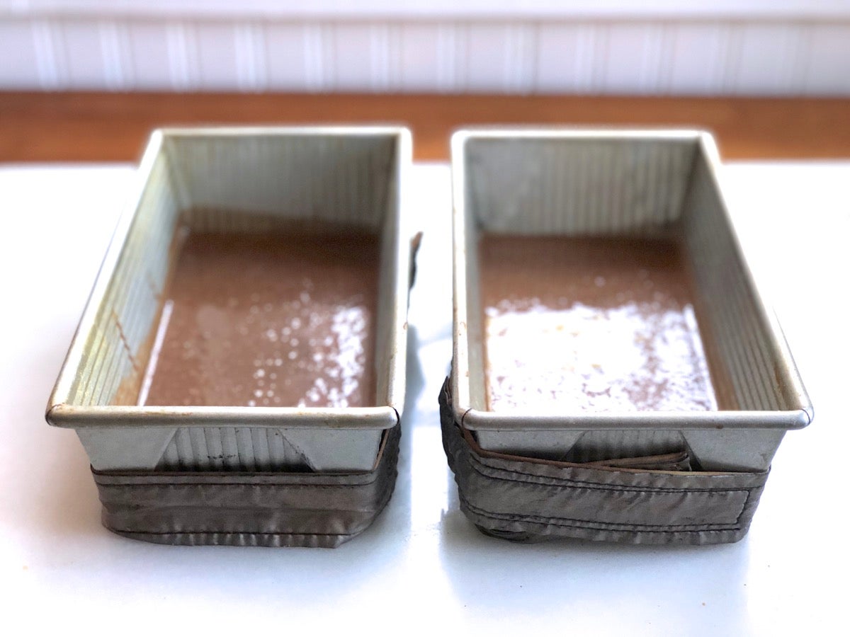 Chocolate Cake Pan Cake batter in two loaf pans, one batter made with Baking Sugar Alternative, one with regular granulated sugar.