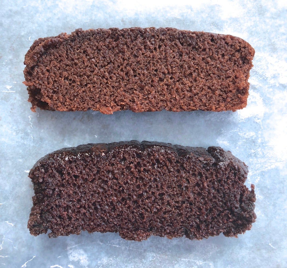 Two slices of chocolate cake, one made with Baking Sugar Alternative, one with regular cane sugar, showing their relative rise.