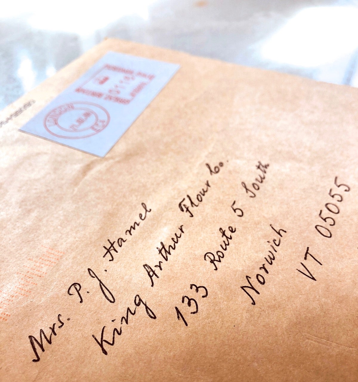An envelope hand-addressed to King Arthur Flour.