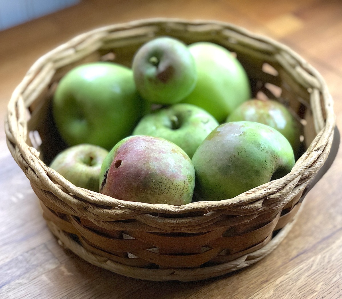 Just-picked apples in a basket.