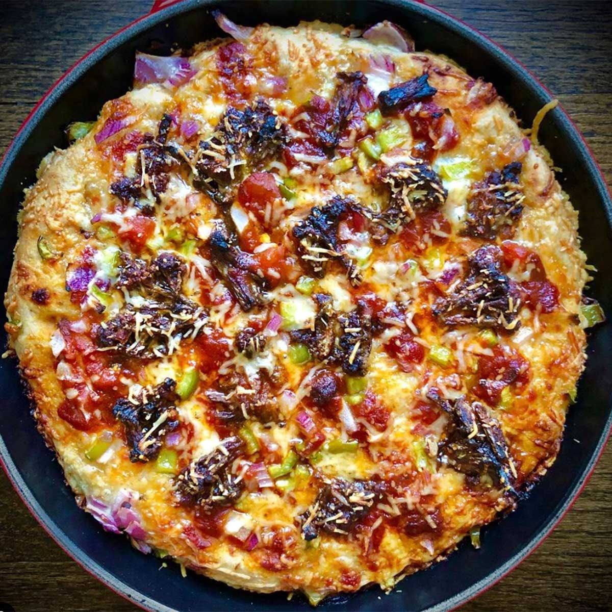 Baked pizza in cast iron skilled