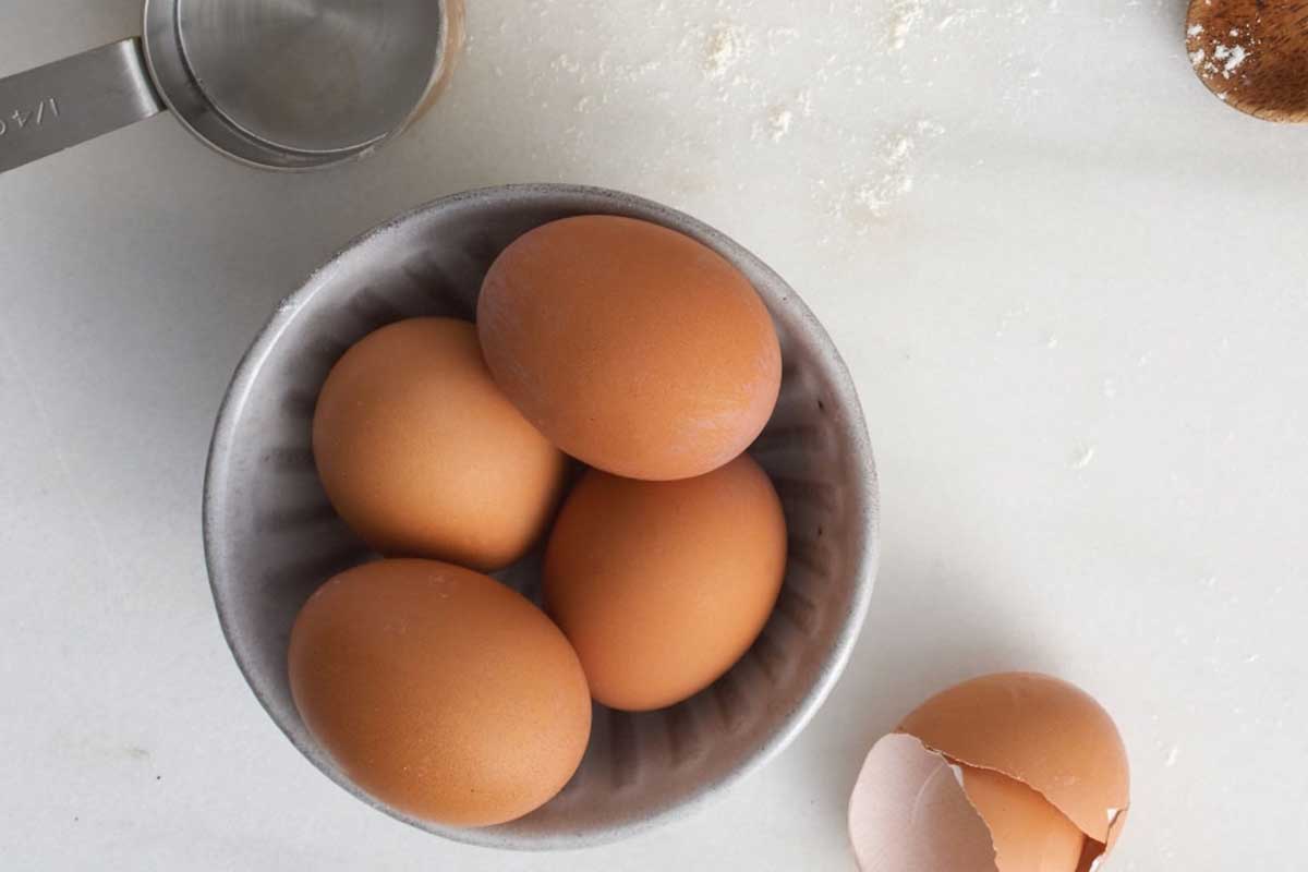 Bowl of un-cracked eggs on the counter