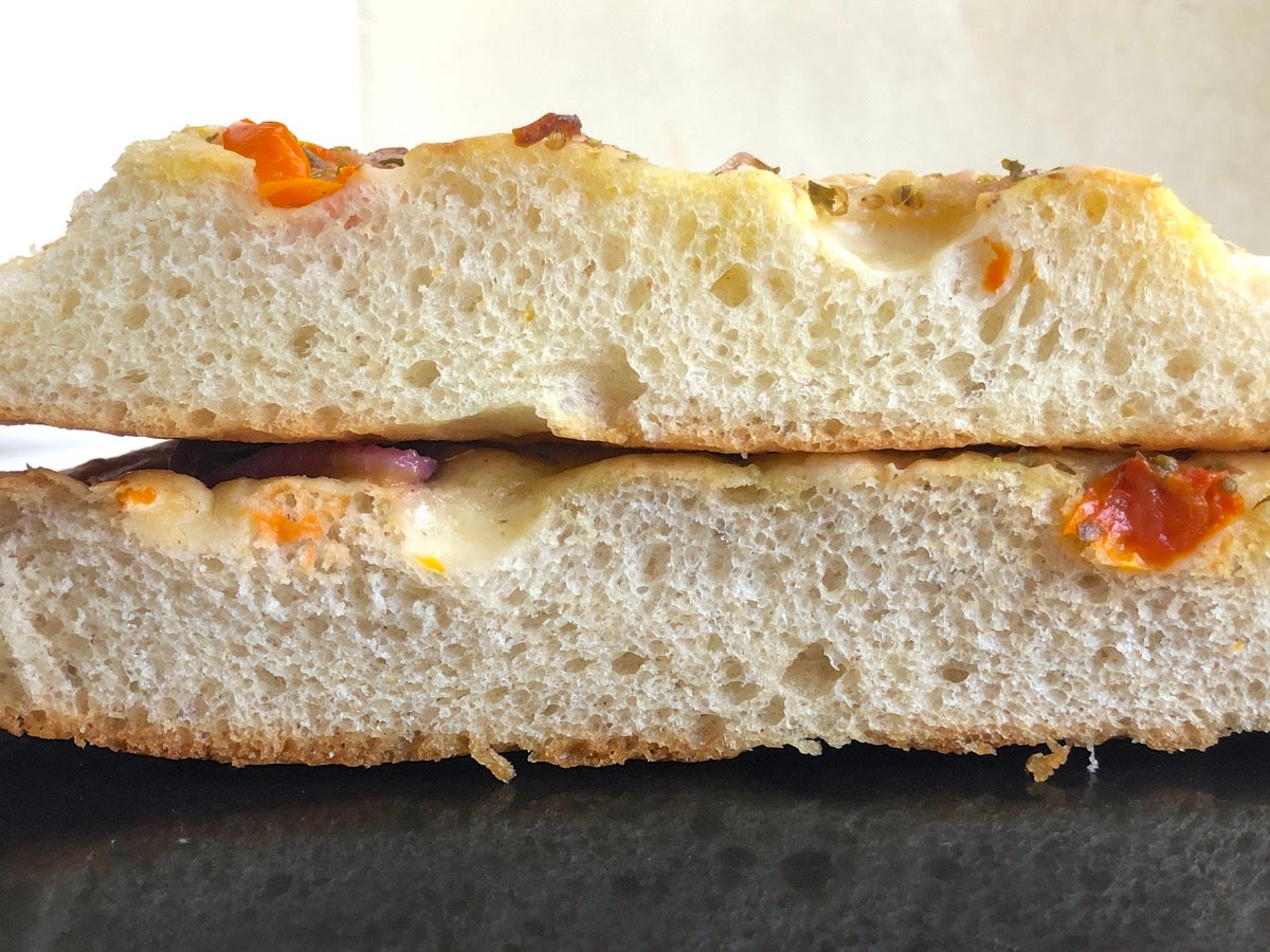 Cross section of focaccia made with all-purpose flour and focaccia made with a combination of all-purpose and rye flours, showing their similar rise.