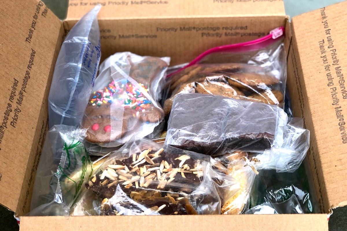 Cookies and bars packed in a Priority Mail box with plenty of air pillows for cushioning.
