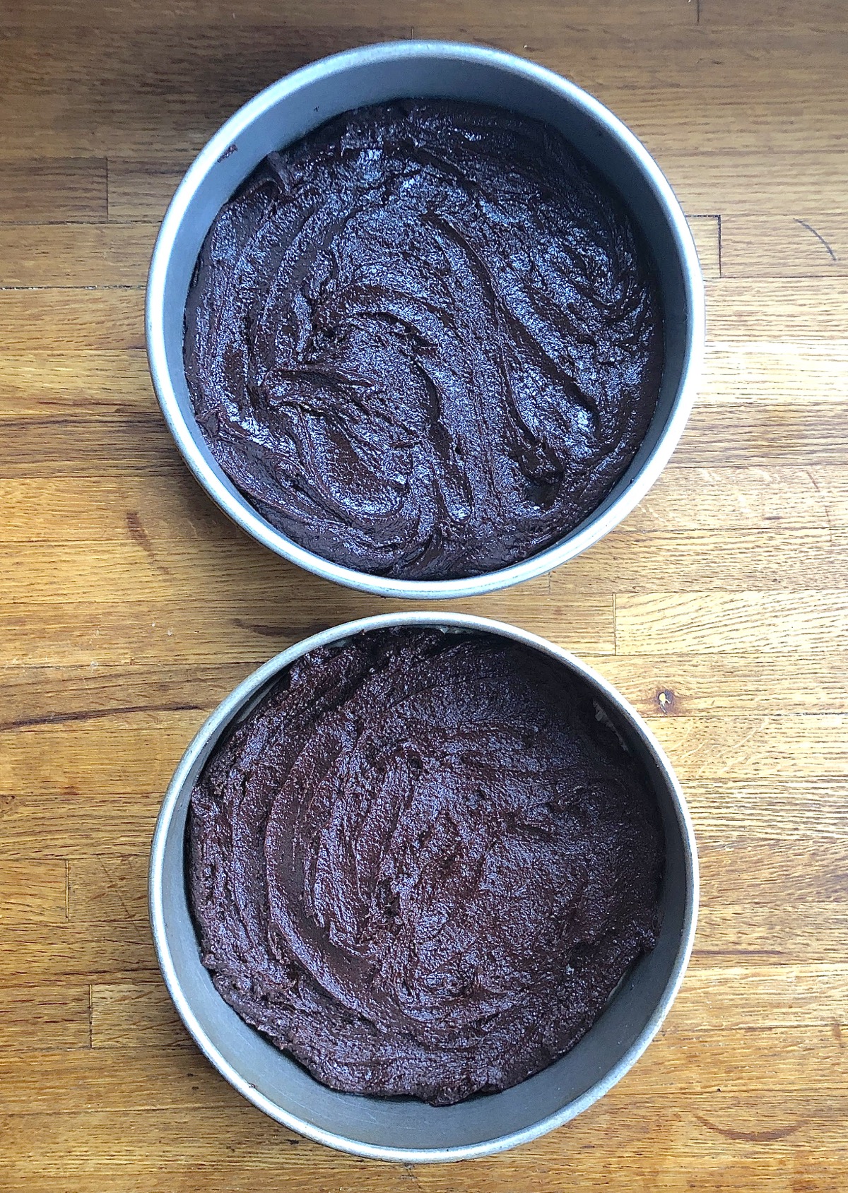Two pans of brownie batter, one made with Truvia, one with granulated sugar