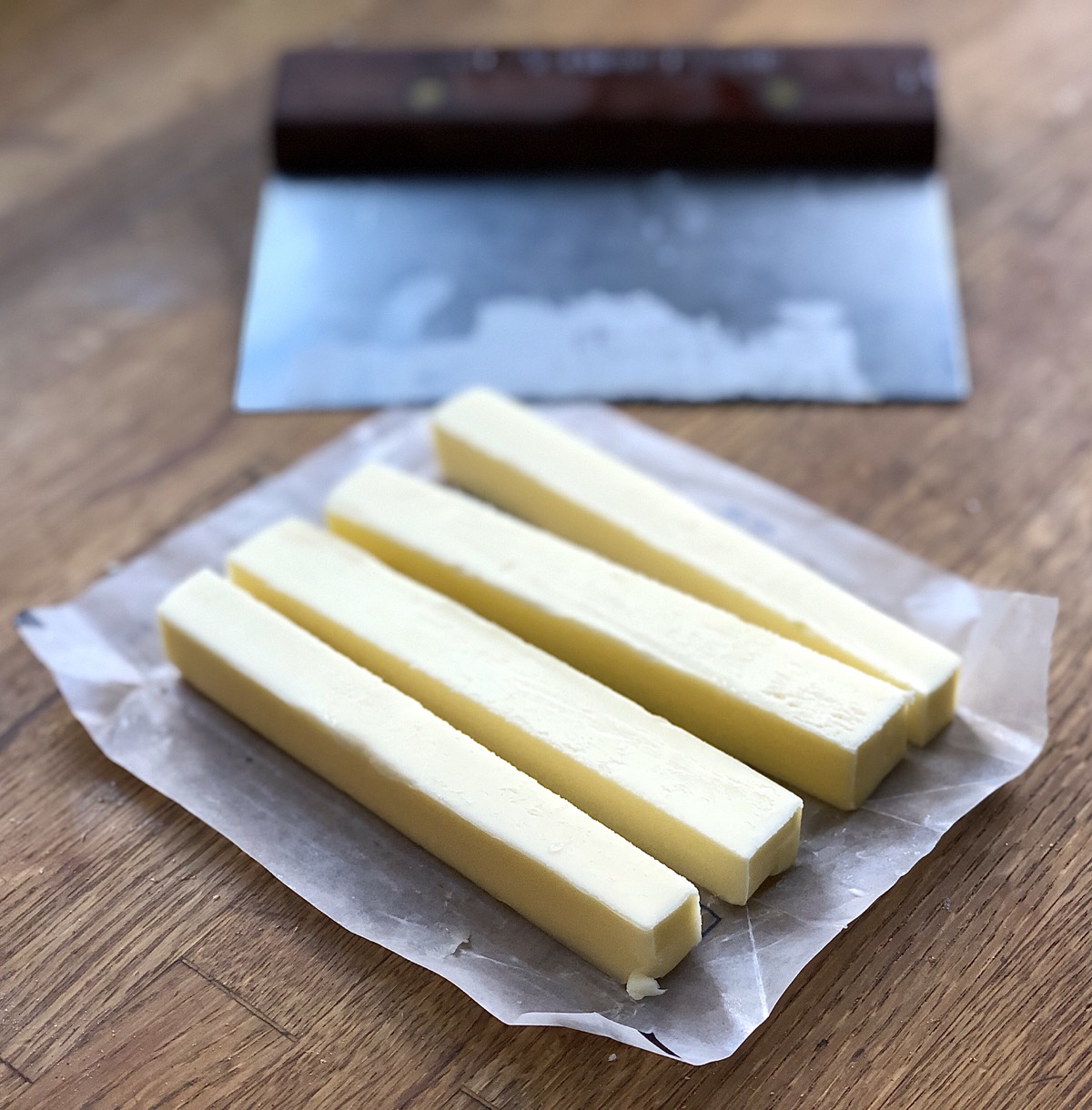 Stick of butter cut into four lengthwise strips.