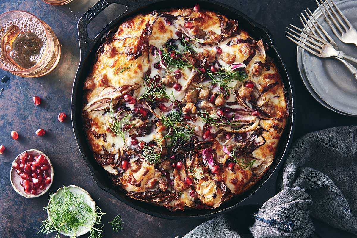 Crispy Cheesy Pan Pizza topped with fennel, radicchio, and sausage