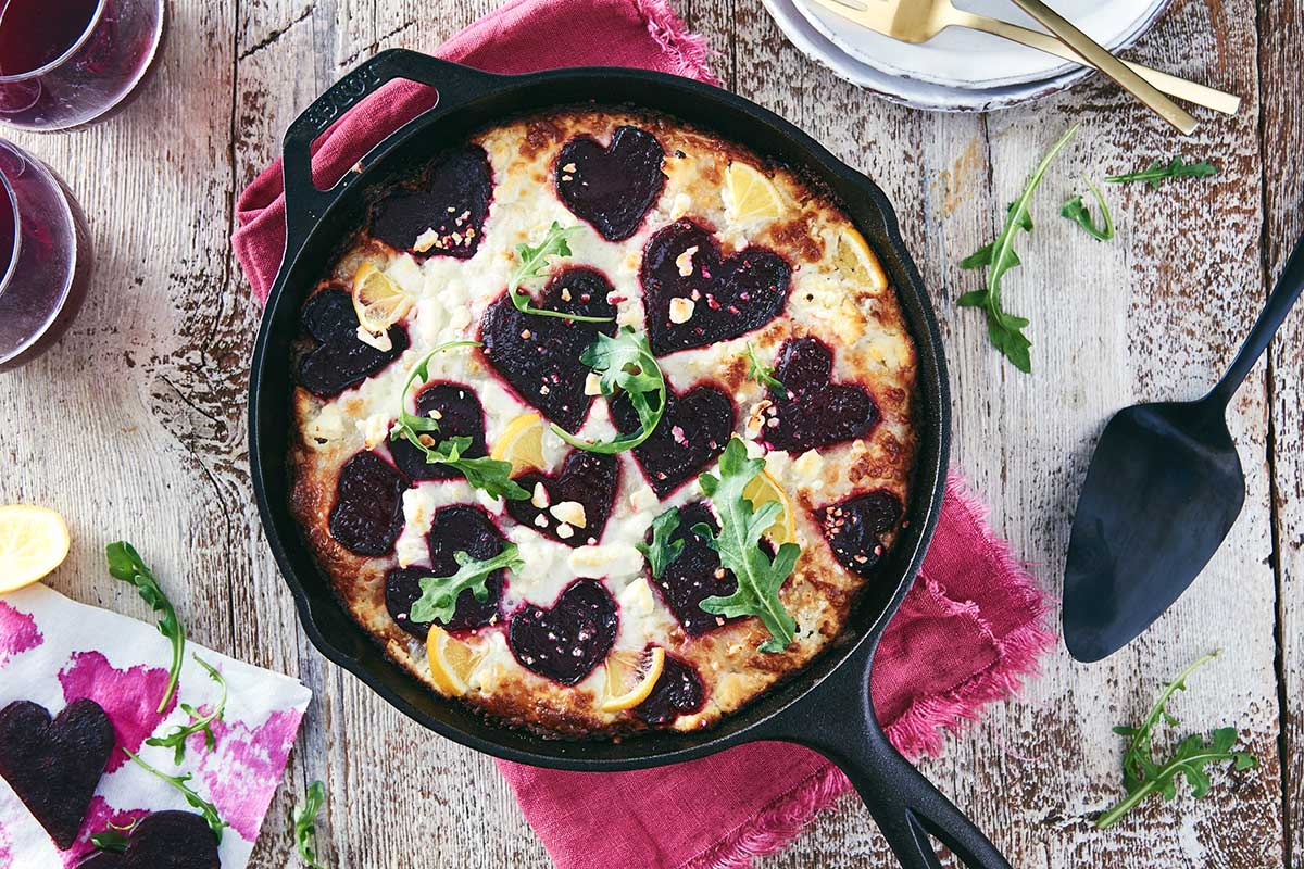 Crispy Cheesy Pan Pizza topped with heart-shaped beets and lemon