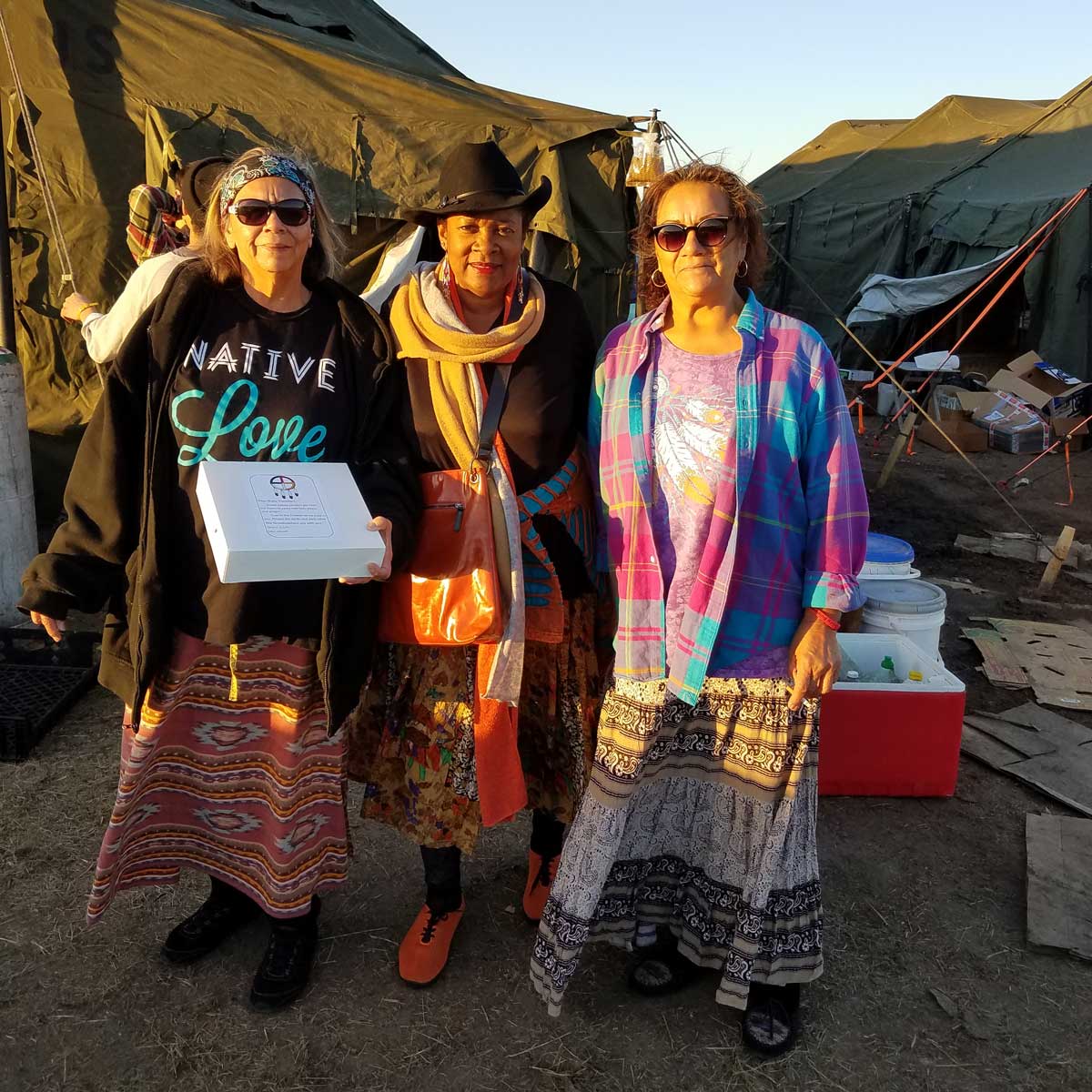 Rose standing with several women at Standing Rock