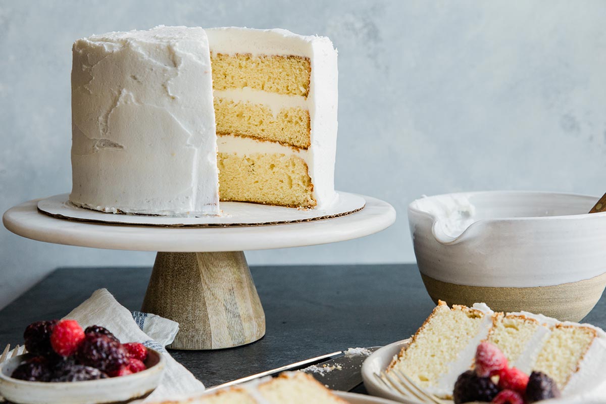 A four-layer yellow cake made with self-rising flour with a slice removed