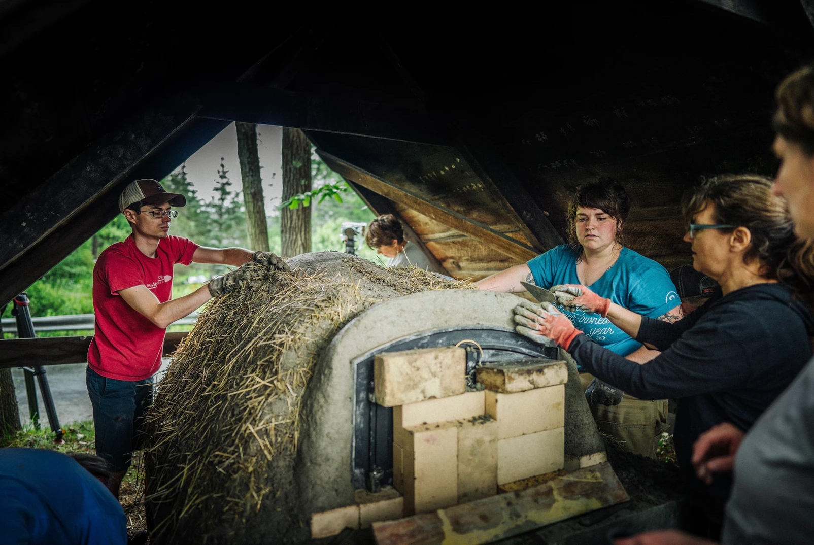 King Arthur volunteers building mud oven
