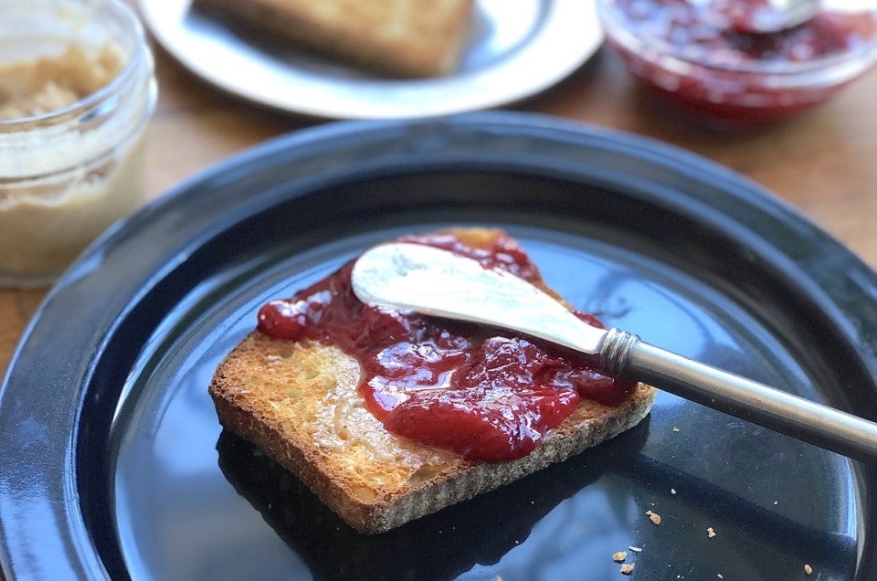 Toast spread with strawberry jam.