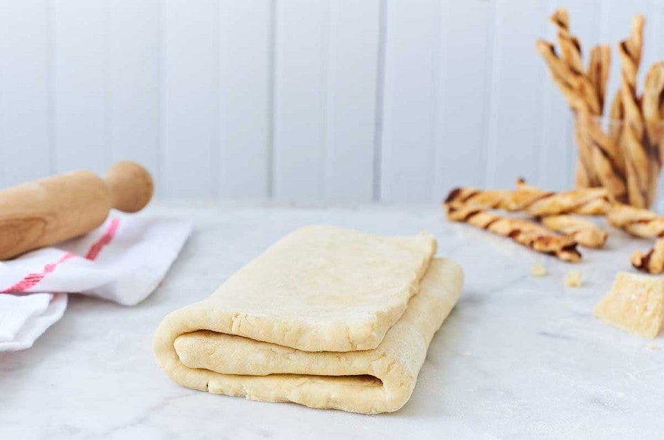 Folded puff pastry dough on the counter