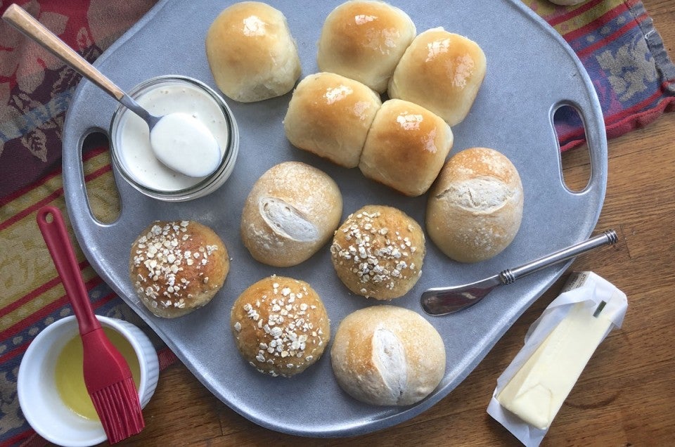 Assorted dinner rolls on pewter tray