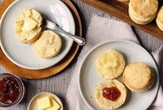 Plated biscuits with butter and jam