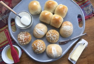 Assorted dinner rolls on pewter tray