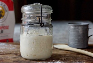Jar of sourdough starter on counter