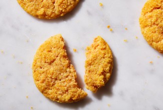 Olive Oil-Orange Sugar Cookies broken in half to a crispy texture