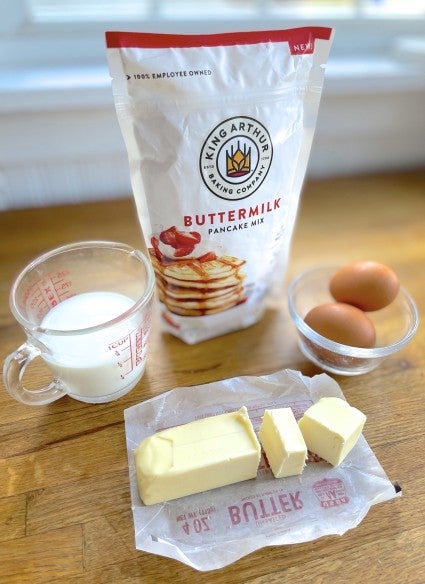 Ingredients for kaiserschmarnn, including milk, eggs, butter, and King Arthur buttermilk pancake mix.