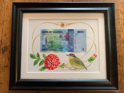 Framed currency from first bakery sale